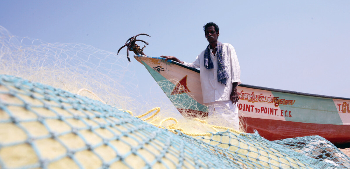 Sundaram from India lost his boat and livelihood after the 2004 Tsunami but received a boat from supporters (circa 2008).